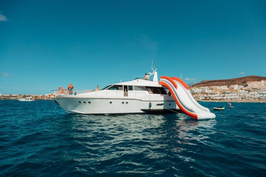 Costa Adeje: Private Yacht Trip with Watersports and Slides - Water slide, scooter, snorkeling, and the rest: what each activity is good for