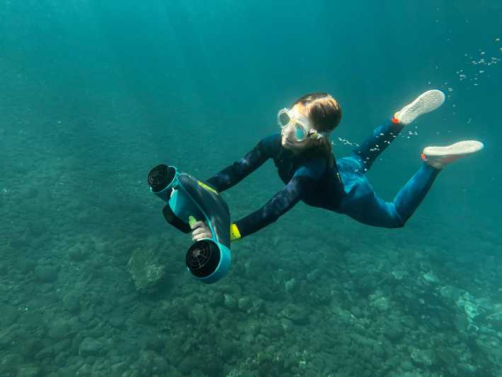 Scooter fun snorcel tour in turtle area - Gear up: wetsuit, mask, tube, fins, and scooter handling