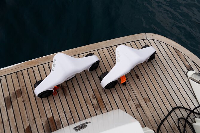Shared Luxury Yacht Cruise with Champagne and Tapas - The Playa del Duque stretch: swimming, sea scooters, and snorkeling gear