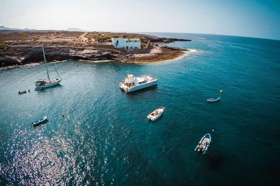Tenerife: Marine-Life Tour with Transfer, Buffet and Drinks - South Tenerife views while the boat stays close to shore