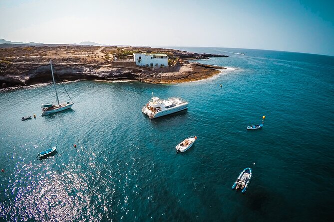 Tenerife Sunset Catamaran tour with transfer - Food and Drinks included. - Meeting at Puerto Colón, with transfers only in the South